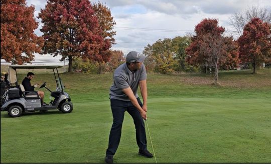 Preparing to hit the golf ball