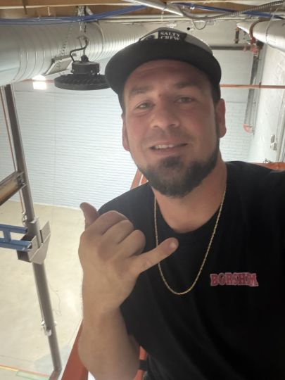 Up on a scissor lift at work