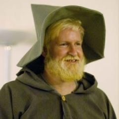 Gandalf! (For the release of the Return of the King in 2003)  I wore a Doctor Who scarf while waiting in line for the release of Harry Potter book 7 in 2007, but I don't think I have any pictures. I knitted it myself in grade school in honor of Tom Baker