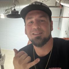 Up on a scissor lift at work